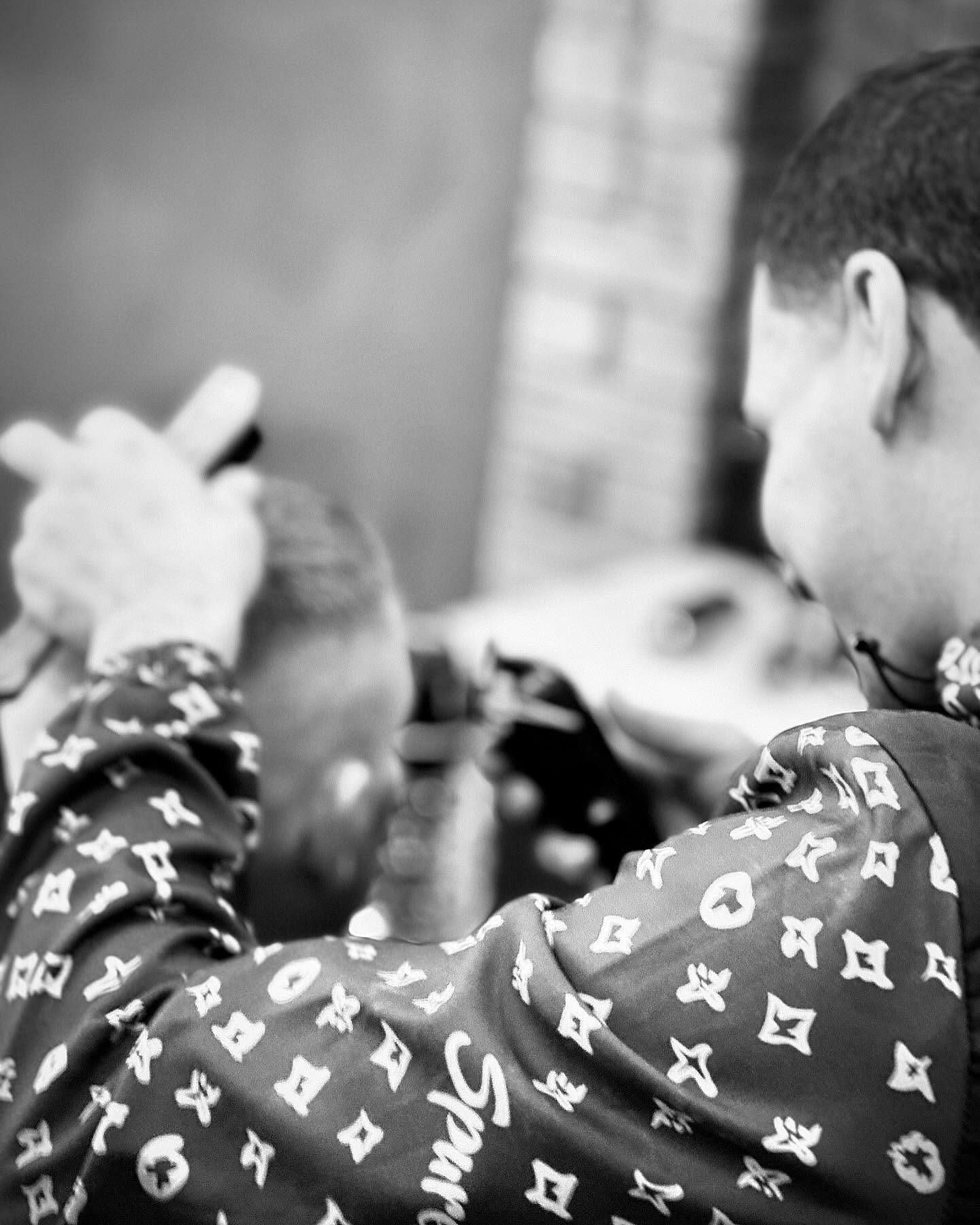 Barber working on a sharp fade